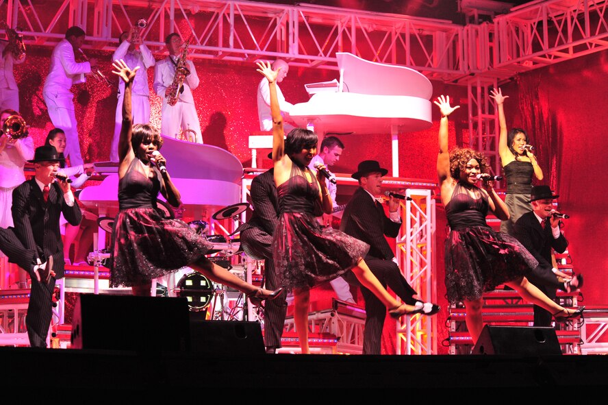 Sumter, S.C. - Tech. Sgt. Alison Maldonado (left), Staff Sgt. Aisha Smith (center), and Senior Airman Tarryn Holyfield, performers with Tops in Blue, sing during a performance for the Sumter community at the Patriot Hall Auditorium Feb 3. Tops in Blue, an ensemble made up of the most-talented Airmen in the force, entertains military and civilian audiences around the globe with music. Their tour encompasses more than 120 shows worldwide and includes numerous shows for deployed Airmen in the Southwest Asia area of operations. (U.S. Air Force photo/Airman 1st Class Amber E. N. Jacobs)