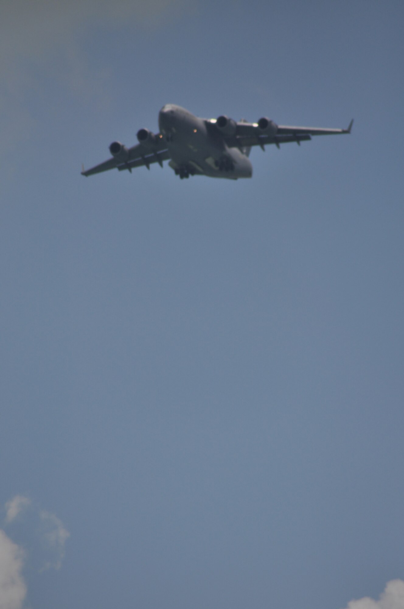 A C-17 Globemaster III conducts a flyover above the 2010 Singapore Airshow held at Changi Airport, Feb. 3, 2010, near Changi Coast, Singapore. The C-17 belongs to Elmendorf Air Force Base, Alaska. The Trade and Airshow occurs every two years  and has participants from all over the world.  (DoD photo/Tech Sgt. Cohen A. Young)