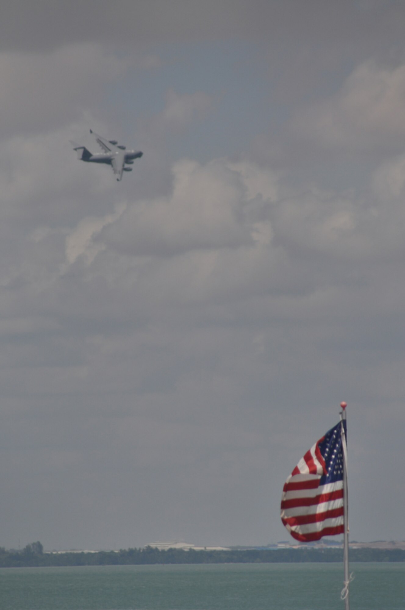 A C-17 Globemaster III conducts a flyover at the 2010 Singapore Airshow held at Changi Airport, Feb. 3, 2010, near Changi Coast, Singapore. The Trade and Airshow occurs every two years and has participants from all over the world.  (DoD photo/Tech Sgt. Cohen A. Young)