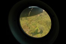 The silhouette of a Royal Thai Air Force C-130 is projected onto a north central Thailand hillside as the crew practices Modular Airborne Firefighting System low-level flying.  The RTAF crew was being instructed by members of the Air Force Reserve’s 302nd Airlift Wing, based at Peterson AFB, Colo.  More than 50 members of the RTAF attended the 302 AW-led training to increase their proficiency with the MAFFS system.  Seven 302 AW members traveled to Thailand to provide expert training on safe and effective C-130 MAFFS operations.  This event marks the first time the Air Force Reserve has sent delegates to train a foreign Air Force on use of the MAFFS equipment.  (U.S. Air Force photo/Capt. Jody L. Ritchie)