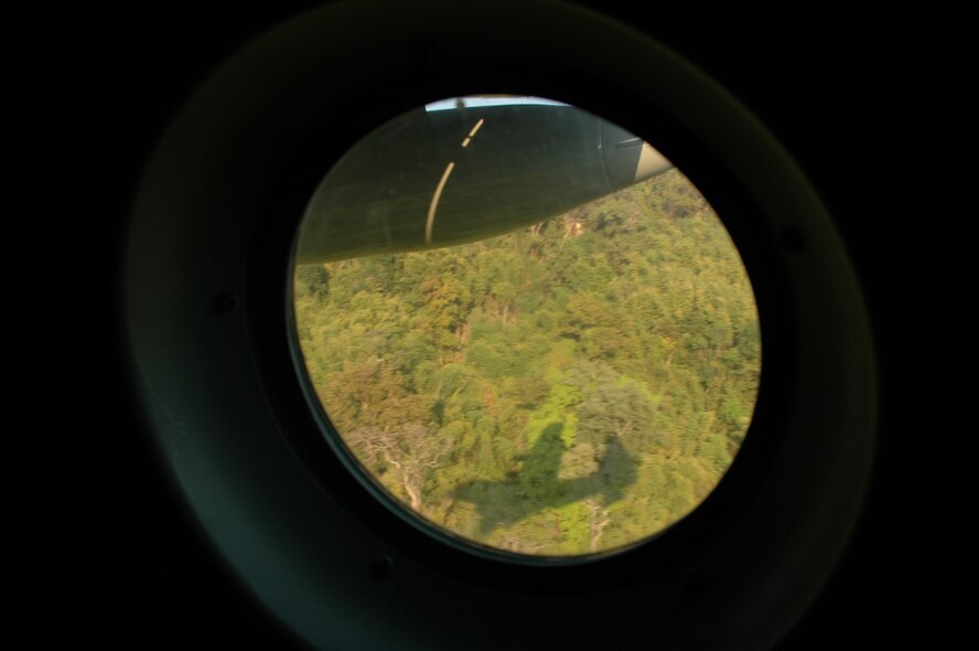 The silhouette of a Royal Thai Air Force C-130 is projected onto a north central Thailand hillside as the crew practices Modular Airborne Firefighting System low-level flying.  The RTAF crew was being instructed by members of the Air Force Reserve’s 302nd Airlift Wing, based at Peterson AFB, Colo.  More than 50 members of the RTAF attended the 302 AW-led training to increase their proficiency with the MAFFS system.  Seven 302 AW members traveled to Thailand to provide expert training on safe and effective C-130 MAFFS operations.  This event marks the first time the Air Force Reserve has sent delegates to train a foreign Air Force on use of the MAFFS equipment.  (U.S. Air Force photo/Capt. Jody L. Ritchie)