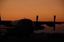 A Royal Thai Air Force C-130 is silhouetted by the sunset at Phitsanulok Royal Thai Air Force Base, Thailand, after a day of Modular Airborne Firefighting System training.   More than 50 members of the RTAF attended MAFFS training led by the Air Force Reserve’s 302nd Airlift Wing, based at Peterson AFB, Colo.   Seven 302 AW members traveled to Thailand to provide expert training on safe and effective 
C-130 MAFFS operations.  This event marks the first time the Air Force Reserve has sent delegates to train a foreign Air Force on use of the MAFFS equipment.  (U.S. Air Force photo/Capt. Jody L. Ritchie)