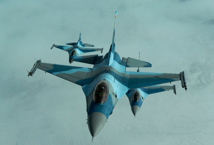 NELLIS AIR FORCE BASE, Nev. -- A three-ship of F-16 Fighting Falcons from the 64th Aggressor Squadron at Nellis fly in formation after refueling Feb. 4 2010, during Red Flag 10.2 being held at Nellis Air Force Base, Nev. Red Flag is a realistic combat training exercise involving the air forces of the United States and its allies. The exercise is conducted on the 15,000-square-mile Nevada Test and Training Range, north of Las Vegas.  (U.S. Air Force photo by Master Sgt. Kevin J. Gruenwald/RELEASED)