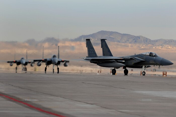 44th Fighter Squadron F-15's prepare to depart Nellis Air Force Base, Nev., flight line for a training mission during Red Flag 10-2 at Nellis Air Force Base, Nev., Feb. 4, 2010. Red Flag is a realistic combat training exercise involving the air forces of the United States and its allies. The exercise is conducted on the 15,000-square-mile Nevada Test and Training Range, north of Las Vegas.(U.S. Air Force photo by Airman 1st Class Brett Clashman/RELEASED)