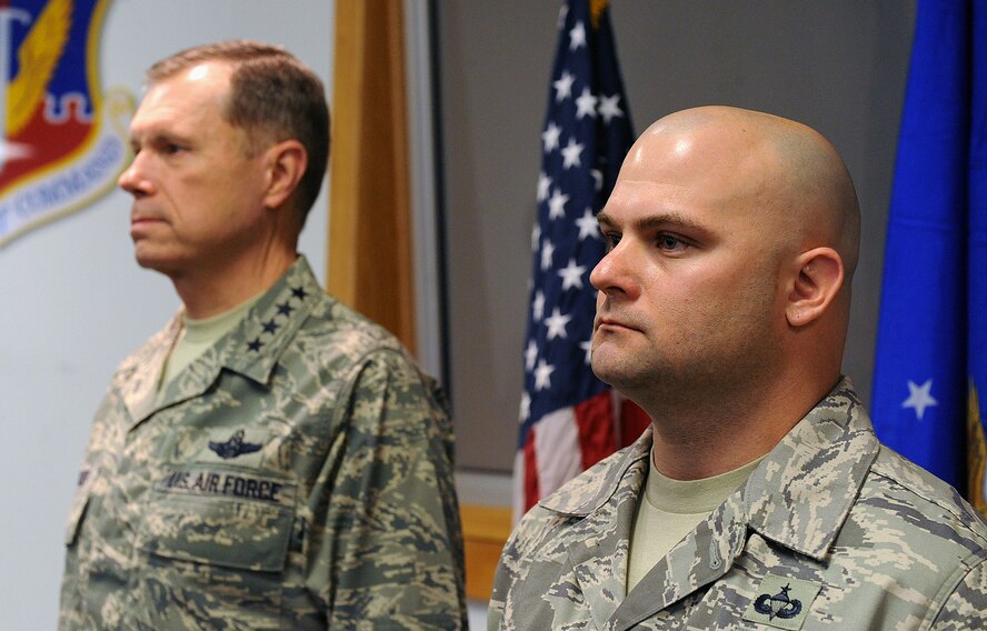 MOODY AIR FORCE BASE, Ga. -- Tech. Sgt. Brandon Livingston, 820th Combat Operations Squadron explosive ordnance disposal craftsman, stands next to Gen. William M. Fraser III, Air Combat Command commander, during a Bronze Star ceremony here Jan. 28. Sergeant Livingston received two Bronze Stars while being deployed. (U.S. Air Force photo by Airman 1st Class Joshua Green)
