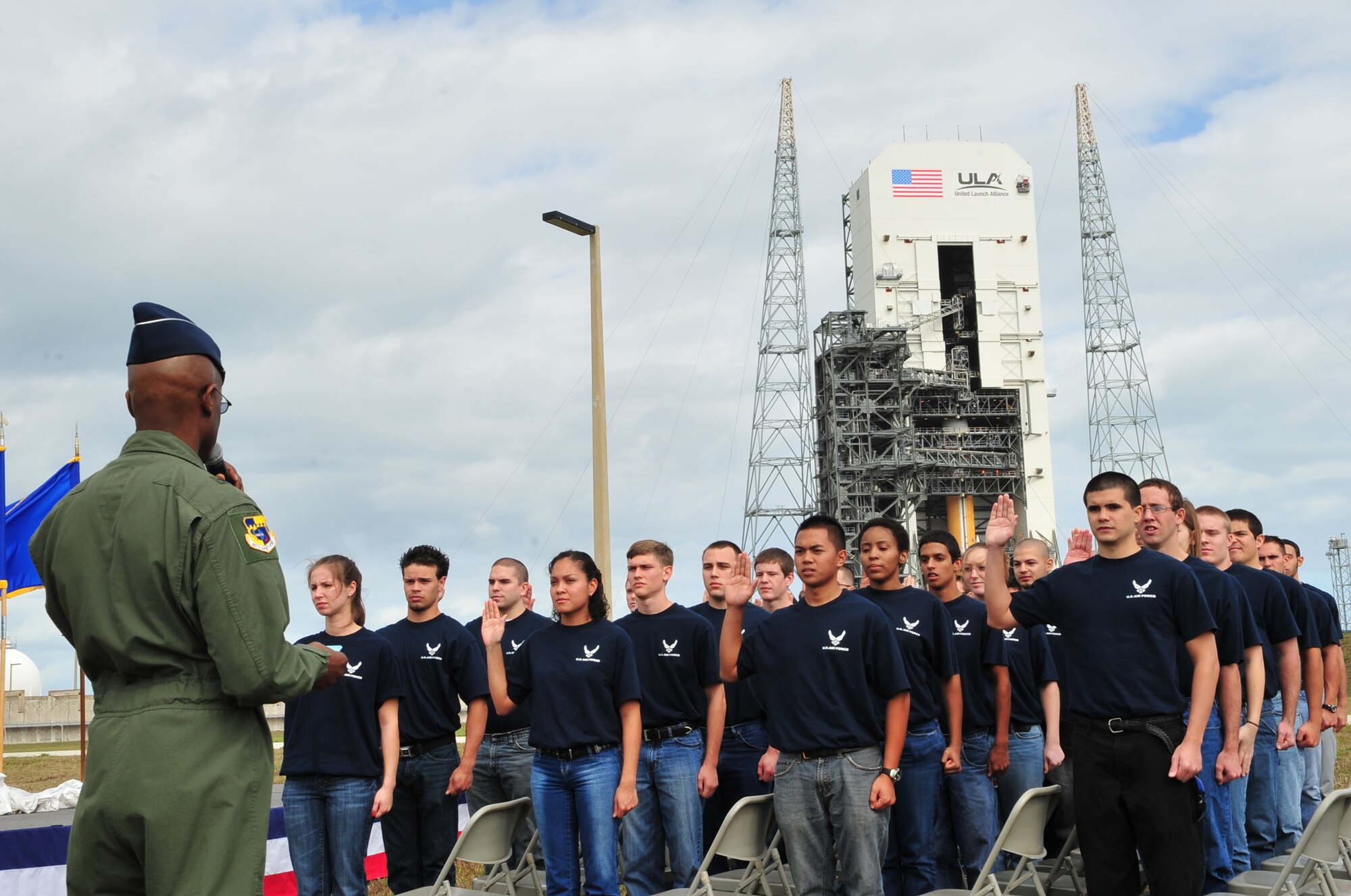Brig. Gen. Edward L. Bolton Jr. inducts 40 Air Force recruits into the Delayed Entry Program Feb. 4, 2010 at Cape Canaveral Air Force Station, Fla. The swearing-in took place in front of a Delta IV being readied for launch. General Edward is the 45th Space Wing Commander. (U.S. Air Force photo/Jennifer Macklin)
