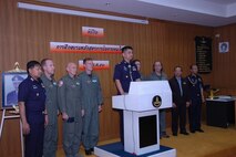 Members of the Air Force Reserve’s 302nd Airlift Wing (left of podium) , based at Peterson AFB, Colo., stand with Special Group Captain (Brig Gen equivalent) Thawonwat Chantanagama, Deputy Director, Director of Operations, Royal Thai Air Force, during closing ceremonies for the Modular Airborne Firefighting System training.  More than 50 members of the RTAF attended the 302 AW-led training to increase their proficiency with the MAFFS system.  Seven 302 AW members traveled to Thailand to provide expert training on safe and effective C-130 MAFFS operations.  This event marks the first time the Air Force Reserve has sent delegates to train a foreign Air Force on use of the MAFFS equipment.  (U.S. Air Force photo/Capt. Jody L. Ritchie)