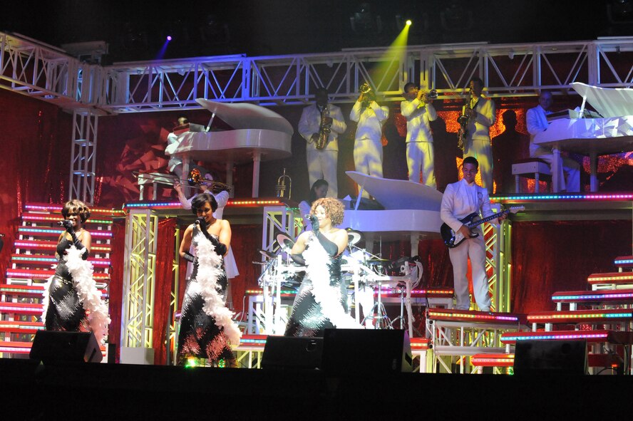 SUMTER, S.C. -- Tech. Sgt. Alison Maldonado (left), Staff Sgt. Aisha Smith (middle) and Senior Airman Tarryn Holyfield, members of Tops In Blue, sing during a performance for the Sumter community at the Patriot Hall Auditorium, Feb. 3. Tops in Blue, an ensemble made up of the most talented Airmen in the force, entertains military and civilian audiences around the globe with music. Their tour encompasses more than 120 shows worldwide and includes numerous shows for deployed Airmen in Southwest Asia. (U.S. Air Force photo/Airman 1st Class Neil D. Warner)