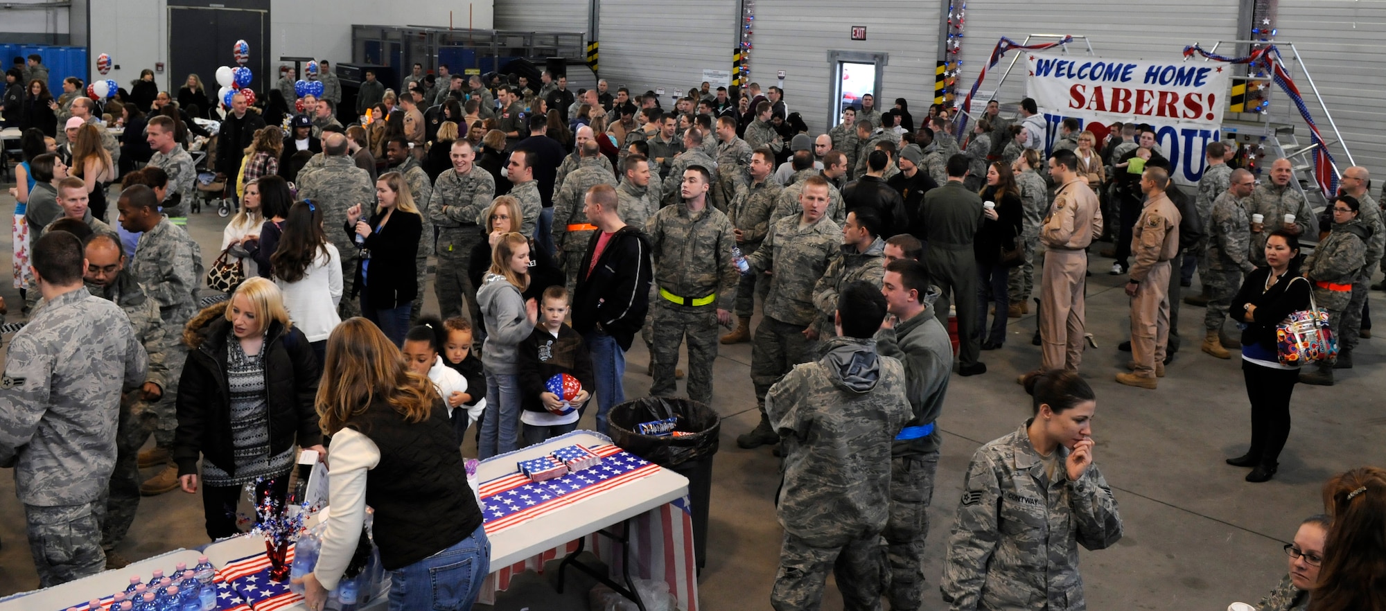SPANGDAHLEM AIR BASE, Germany –Family and friends await the arrival of more than 300 Sabers returning from a four-and-a-half month deployment to Joint Base Balad, Iraq, in support of Operation Iraqi Freedom Feb. 5. The operation supported 1,600 sorties and logged 6,300 flight hours.  (U.S. Air Force photo/Airman 1st Class Staci Miller)