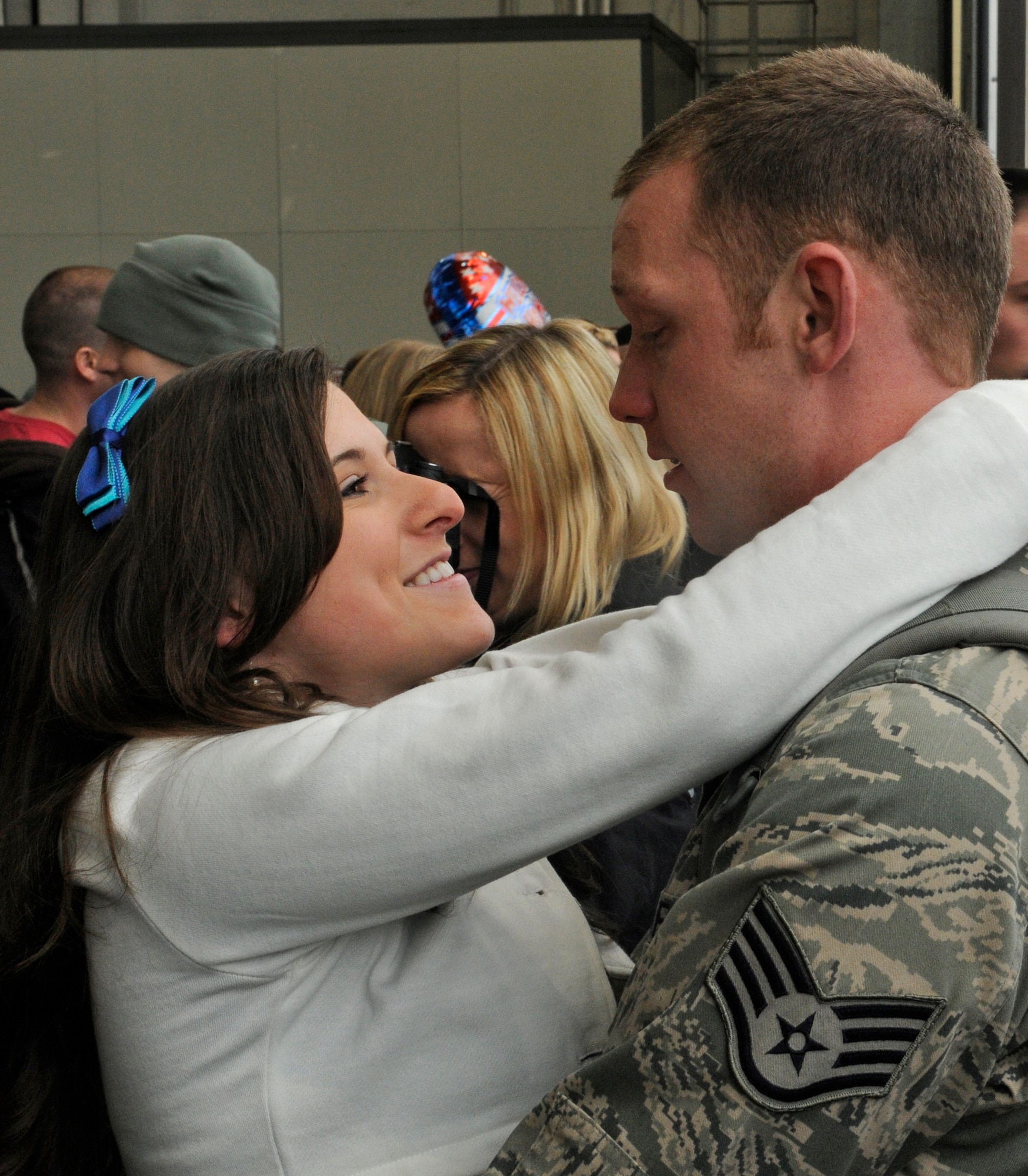 SPANGDAHLEM AIR BASE, Germany – Meghan Burkhart welcomes back her husband, Staff Sgt. Thomas Burkhart, 52nd Equipment Maintenance Squadron, as he returns from a deployment with the 23rd Fighter Squadron Feb. 5. More than 300 members returned to Spangdahlem after a four-and-a-half month deployment to Joint Base Balad, Iraq, in support of Operation Iraqi Freedom. (U.S. Air Force photo/Senior Airman Benjamin Wilson)