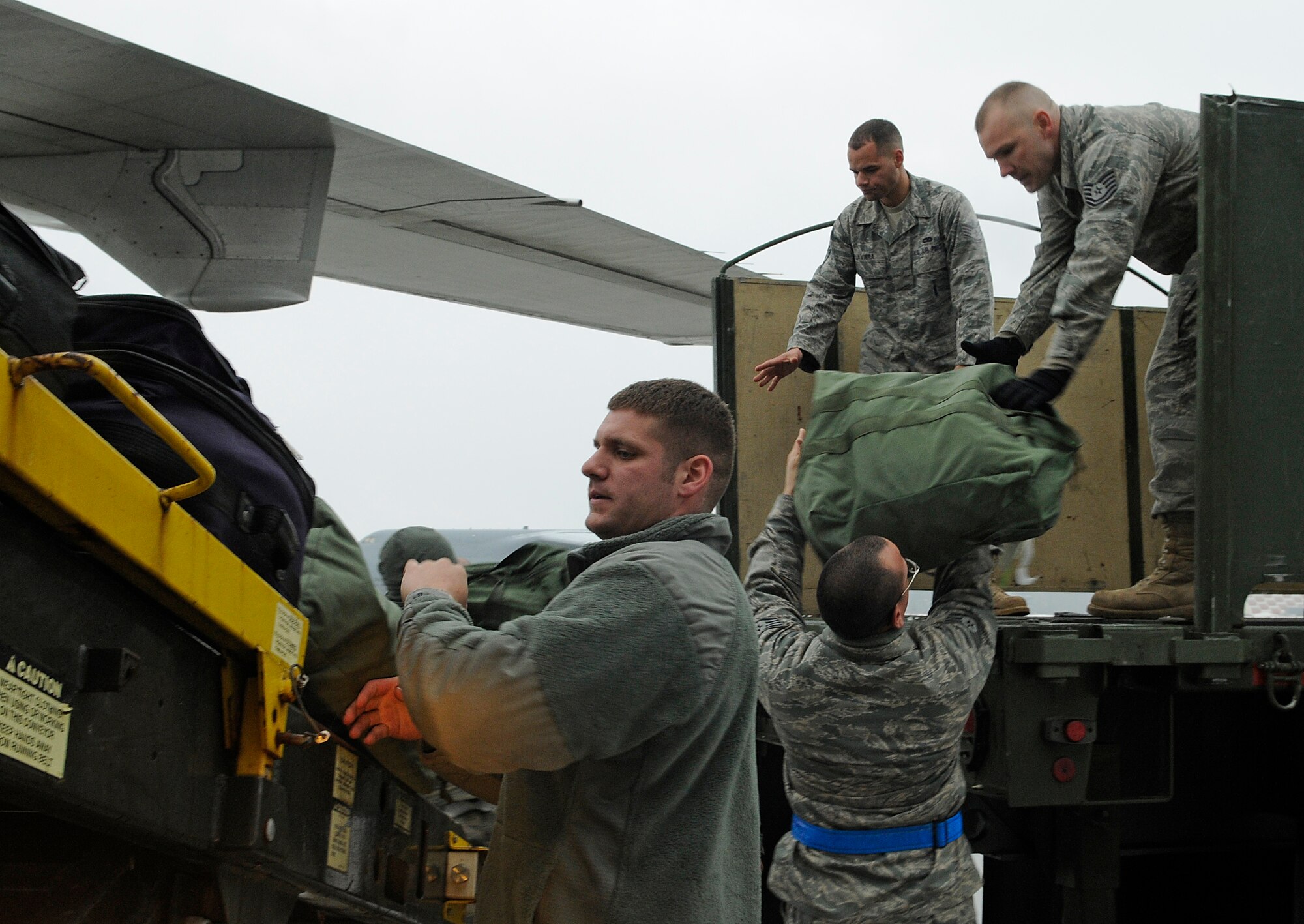 SPANDAHLEM AIR BASE, Germany – Saber maintainers returning from a deployment supporting the 23rd Fighter Squadron unload gear on Spangdahlem Air Base’s flightline Feb. 5. More than 300 members returned to Spangdahlem after a four-and-a-half month deployment to Joint Base Balad, Iraq, in support of Operation Iraqi Freedom. (U.S. Air Force photo/Senior Airman Benjamin Wilson)