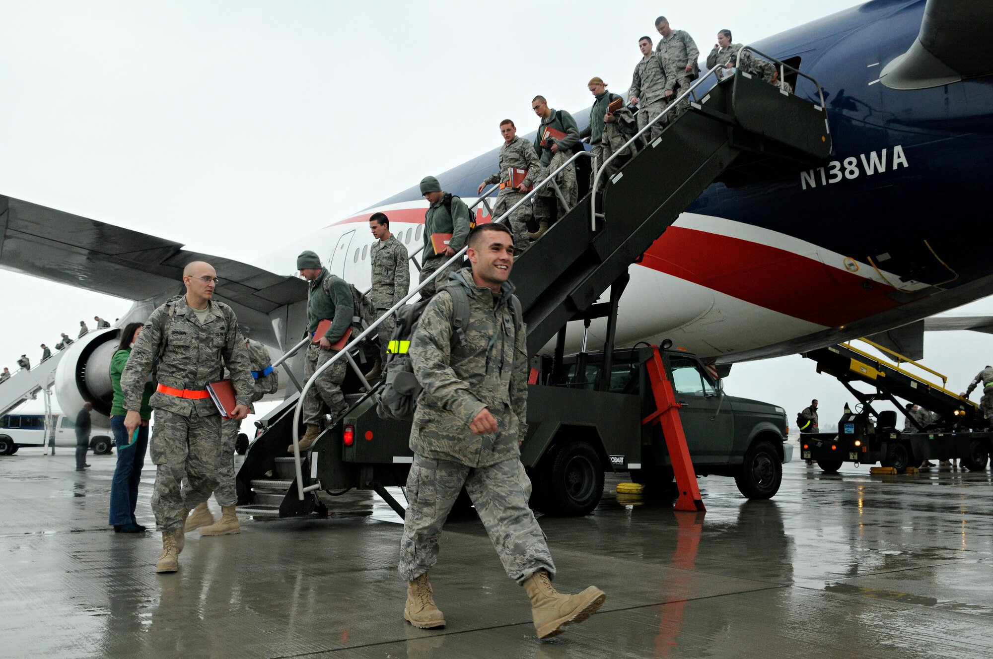 SPANGDAHLEM AIR BASE, Germany – Saber maintainers returning from a deployment supporting the 23rd Fighter Squadron exit a plane on Spangdahlem Air Base’s flightline Feb. 5. More than 300 members returned to Spangdahlem after a four-and-a-half month deployment to Joint Base Balad, Iraq, in support of Operation Iraqi Freedom. (U.S. Air Force photo/Senior Airman Benjamin Wilson)