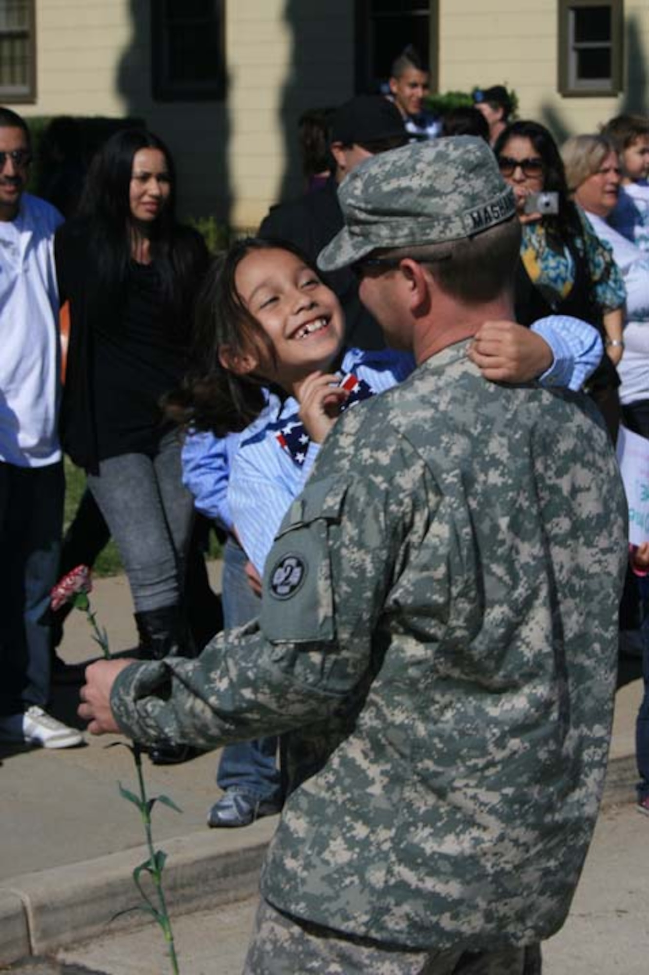Loved ones welcome home Sgt. Brian Mashaney at the U.S. Army Reserve's 437th Medical Company Ground Ambulance's Welcome Home Warrior-Citizen Ceremony held at March Air Reserve Base, Calif., Feb. 3, 2010.  The 73 Soldiers in the company deployed to Kuwait on March 2, 2009. (U.S. Army photo/Maj. Matthew Lawrence)