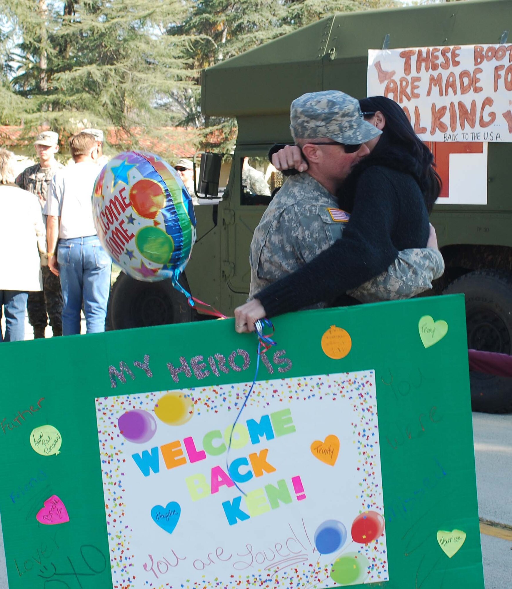Sfc. Kenneth Donovan hugs his fiance, Taumi Kinney at the U.S. Army Reserve's 437th Medical Company Ground Ambulance' Welcome Home Warrior-Citizen Ceremony held at March Air Reserve Base, Calif., Feb. 3, 2010.  The 73 Soldiers in the company deployed to Kuwait on March 2, 2009. (U.S. Air Force photo/Megan Just)