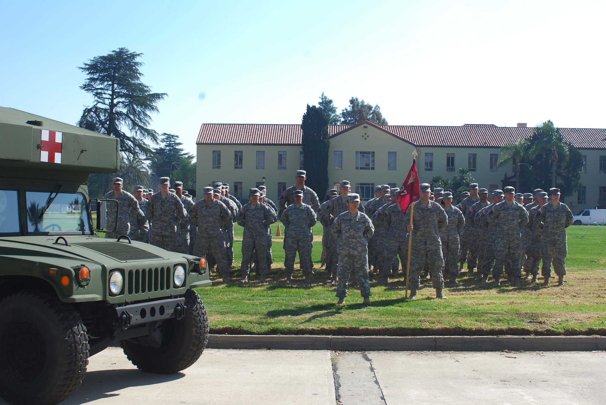 Just returned from deployment, Soldiers stand at parade rest for a group photograph at the U.S. Army Reserve's 437th Medical Company Ground Ambulance's  Welcome Home Warrior-Citizen Ceremony held at March Air Reserve Base, Calif., Feb. 3, 2010.  The 73 Soldiers in the company deployed to Kuwait on March 2, 2009. (U.S. Air Force photo/Megan Just)