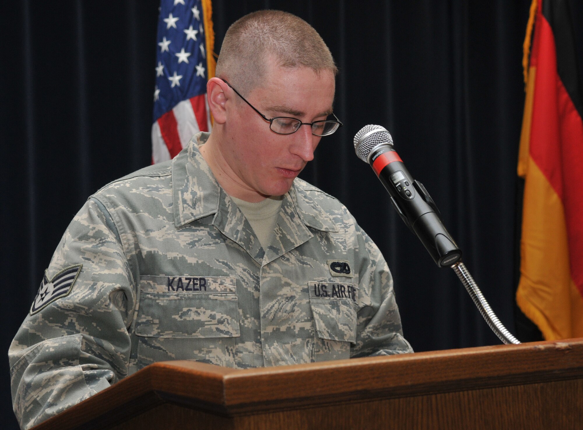 SPANGDAHLEM AIR BASE, Germany -- Staff Sgt. Aaron Kazer, 726th Aircraft Maintenance Squadron, reads a passage from the book of Psalms during Spangdahlem's 2010 National Prayer Luncheon Jan. 29 at Club Eifel. The national prayer luncheon is an annual interface luncheon that recognizes moral and religious values. (U.S. Air Force Photo/Airman 1st Class Nick Wilson)