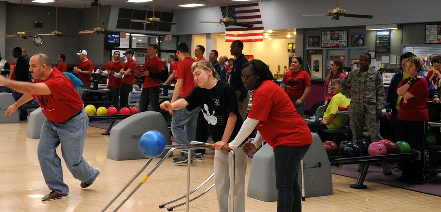 BARKSDALE AIR FORCE BASE, La. – Volunteer Airman 1st Class Shaneka Robinson, 608th Air Communications Squadron knowledge operator, assists Jessica Boles, Special Olympics athlete, during Barksdale’s second annual bowling tournament Jan. 29. More than 70 volunteers and 150 special needs athletes showed up for the two-day event at the Barksdale 16-Lane Bowling Center. (U.S. Air Force photo by Senior Airman La’Shanette V. Garrett)(RELEASED)