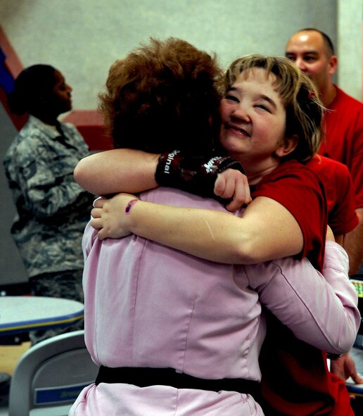 BARKSDALE AIR FORCE BASE, La. – Special Olympics athlete Amanda Pittmon embraces her grandmother Barbara Reynolds, visiting from Reno, Nev., after making a spare during Barksdale’s second annual bowling tournament Jan. 28. More than 70 volunteers and 150 special needs athletes showed up for the two-day event at the Barksdale 16-Lane Bowling Center. (U.S. Air Force photo by Senior Airman La’Shanette V. Garrett)(RELEASED)