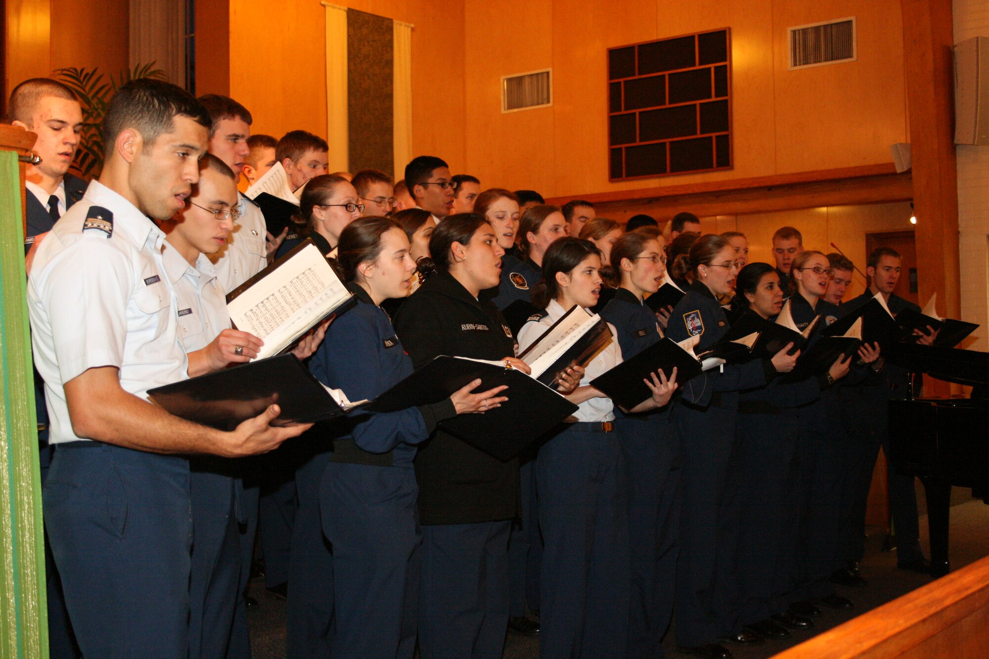 EGLIN AIR FORCE BASE, Fla. - The United States Air Force Academy Catholic Cadet Choir practices their concert before sharing their music with Eglin Jan. 30, 31. The choir travels occasionally to communities on or around military bases and relies on military airlift for their trips.  Gary De Kler directs the choir with Col. Paul Pirog as the officer in charge.  (U.S. Air Force photo/ 2nd Lt. Andrew Caulk)