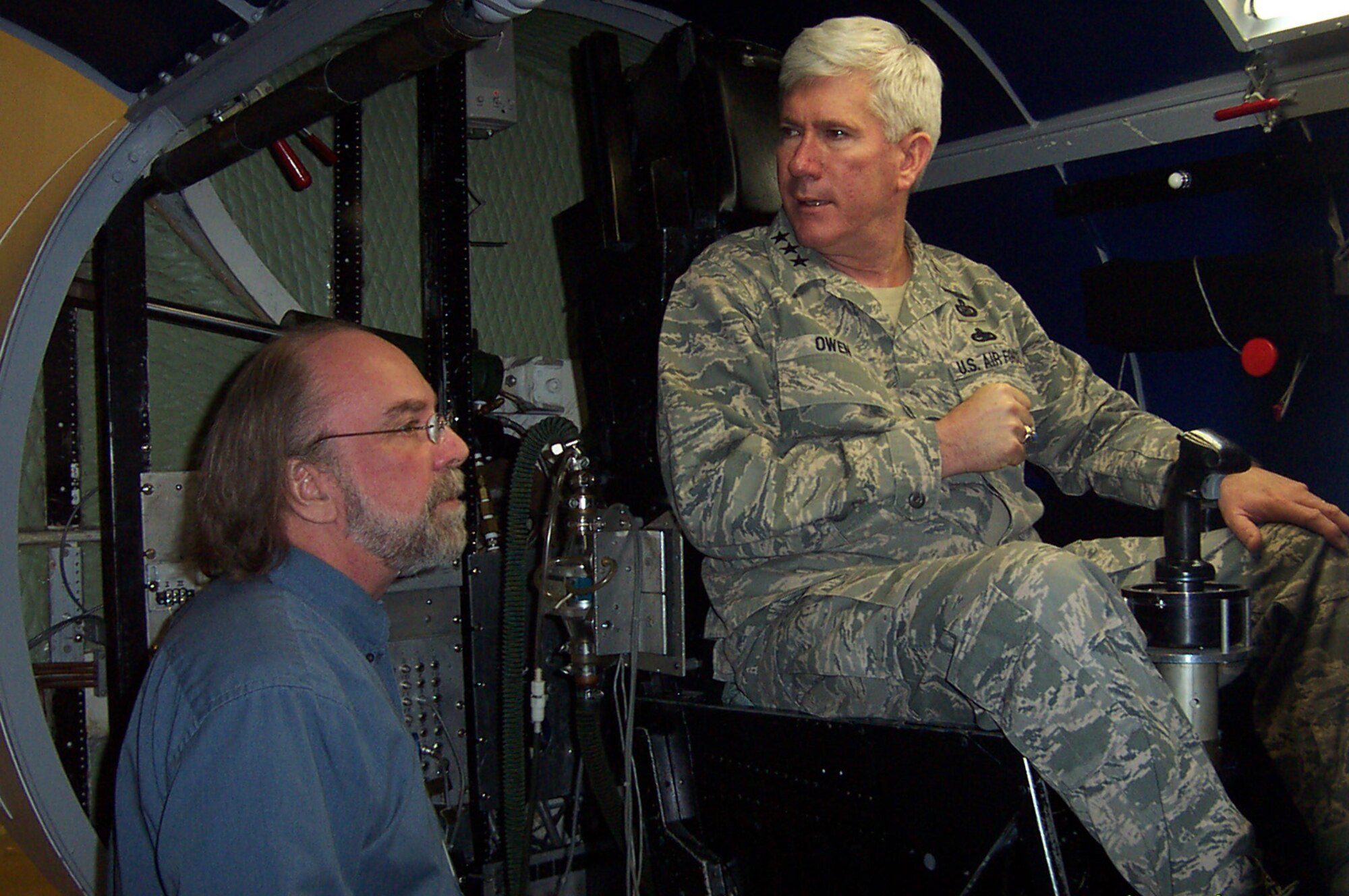 Lt. Gen. Thomas Owen is briefed by Wayne Isdahl from the 711th Human Performance Wing at Brooks City-Base, Texas, on capabilities of the U.S. Air Force School of Aerospace Medicine centrifuge, as the general sits in the centrifuge's gondola. The centrifuge is used to train pilots and aircrew members of the effects of high g-forces on the human body and how to handle those forces. General Owen is Aeronautical System Center commander at Wright-Patterson Air Force Base, Ohio. (U.S. Air Force photo/Joe N. Wiggins) 
