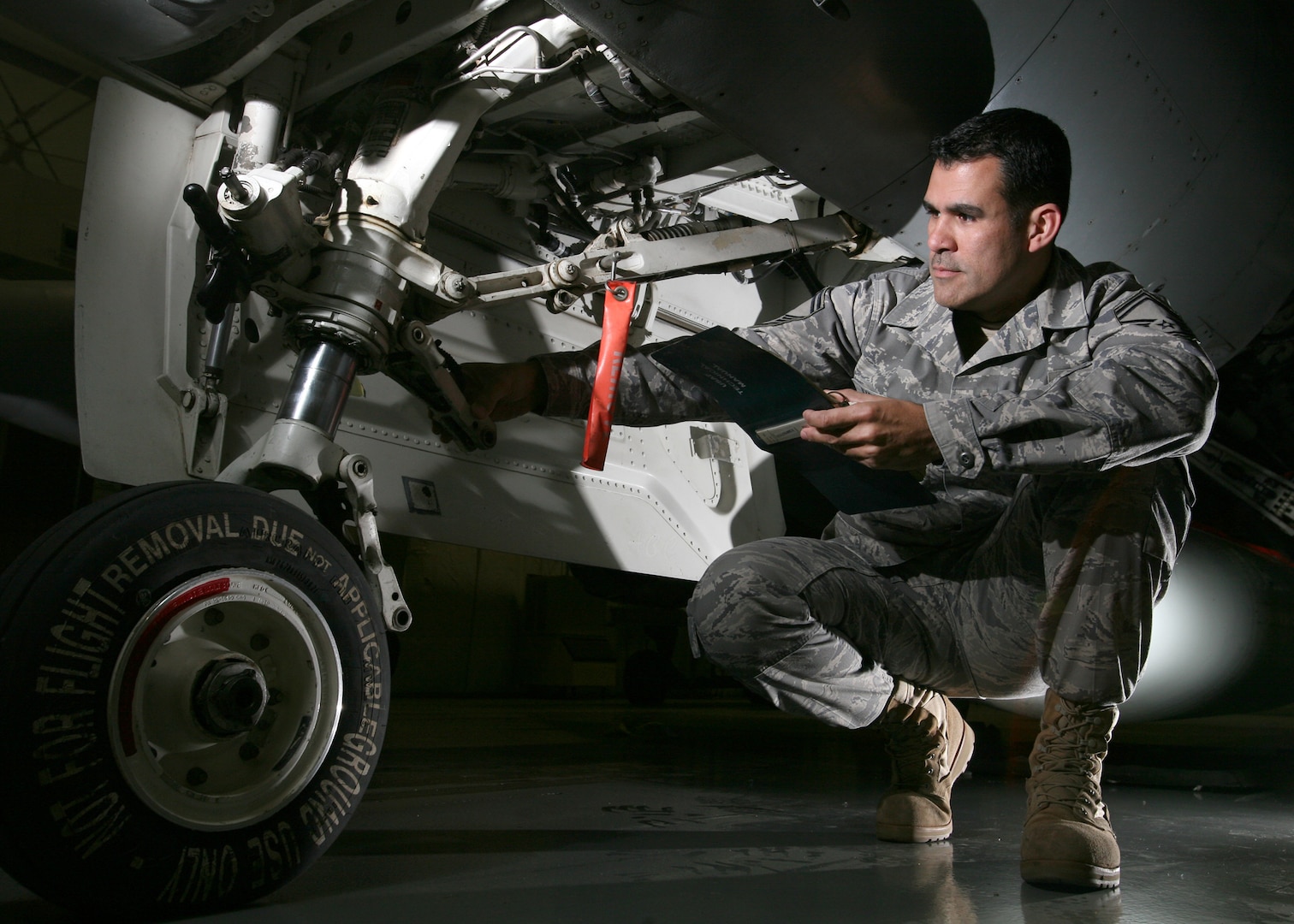 Senior Master Sgt. David Pantojas, Inter-American Air Forces Academy, performs validation checks Jan. 25 to ensure aircraft systems are ready for the upcoming maintenance training courses taught at IAAFA. Instructors at IAAFA provide training to 21 Latin American nations on 20 different aircraft maintenance related courses. (U.S. Air Force photo/Robbin Cresswell)