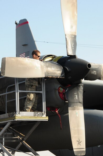 U.S. Air Force Senior Airman Mark Perko, 386th Expeditionary Aircraft Maintenance Squadron C-130H crew chief, performs a seven-day inspection on a C-130 engine prop Jan. 22, 2010 at an air base in Southwest Asia. Airman Perko is deployed from Dyess Air Force Base, Texas. (U.S. Air Force photo by Staff Sgt. Lakisha A. Croley/Released)