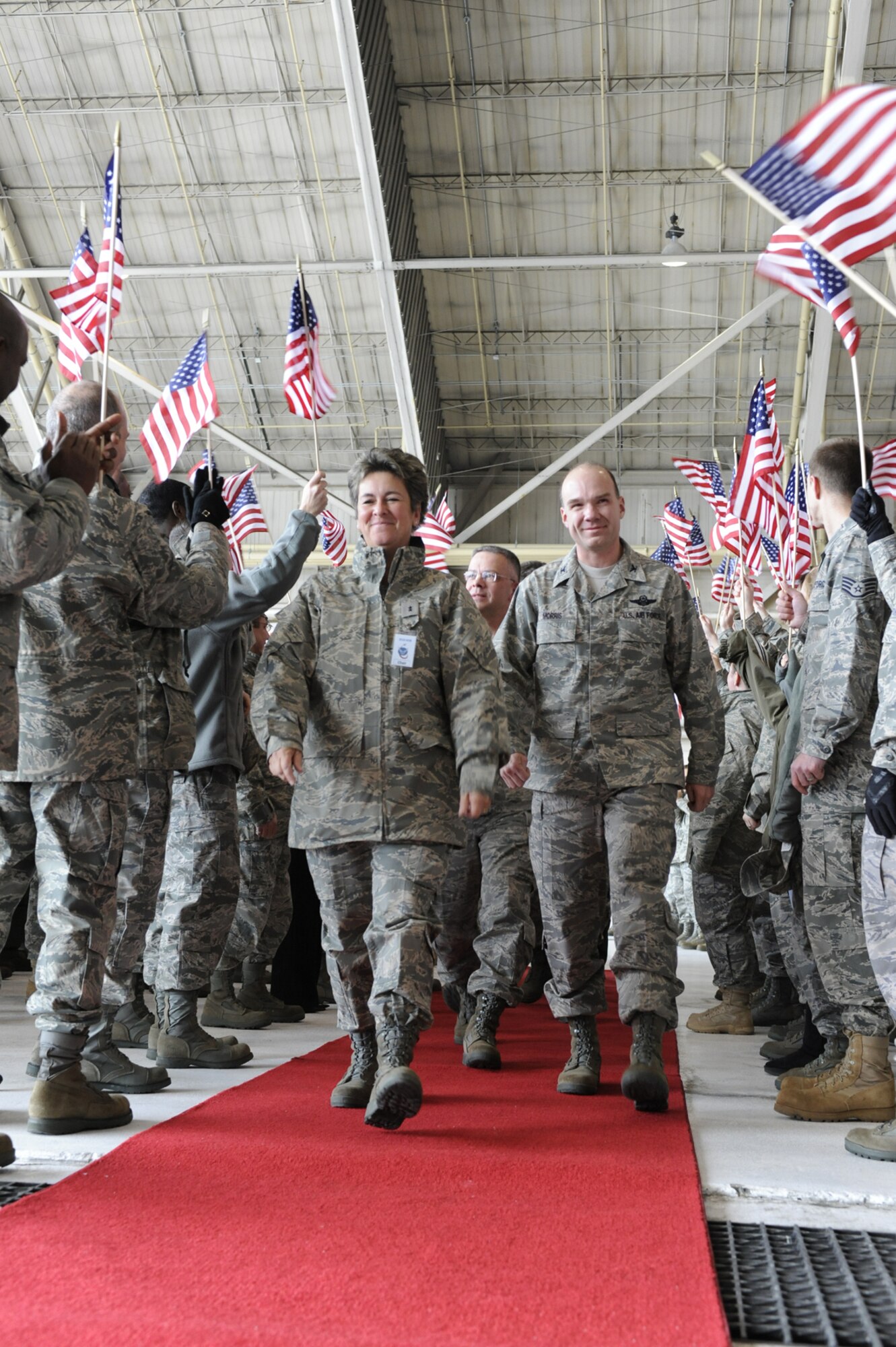 (Right) Col. Manson Morris, 436th Airlift Wing commander, escorts the Commander-in-Chief's Installation Excellence Selection Board Feb. 2 at Hanger 706 to the send-off rally in their honor. The rally was the finale of the day and half CINC IE evaluation to determine installation is the best in the Air Force. This year the finalists were Elmendorf AFB, Alaska and Dover AFB, Del. (U.S. Air Force photo/Roland Balik)