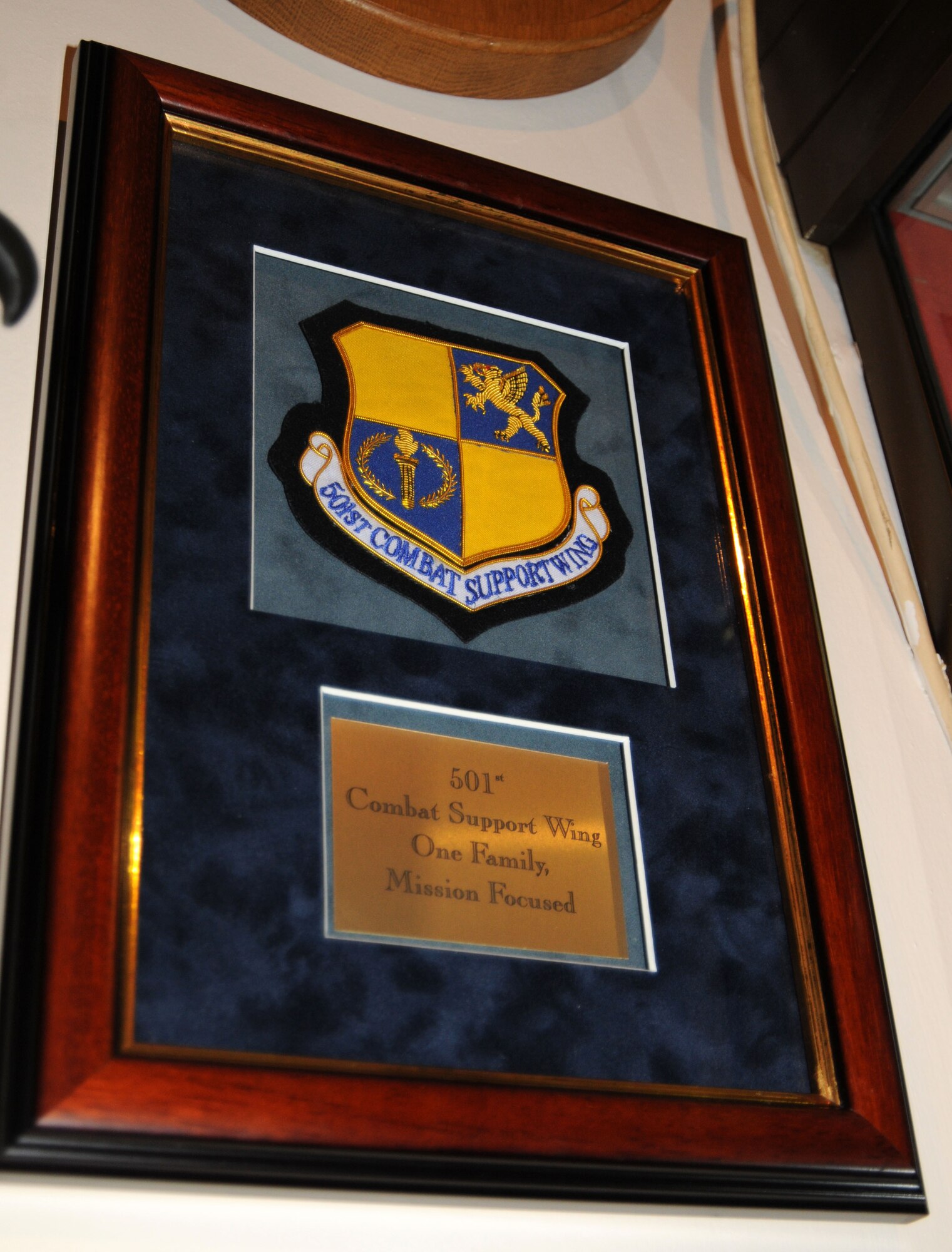 RAF ALCONBURY, United Kingdom - The 501st Combat Support Wing presented a plaque to the Yeoman Warder's Mess as a token of appreciation after touring the Tower of London. More than 40 leaders and their spouses from the 501st Combat Support Wing here traveled to the Tower of London as part of a leadership conference Feb. 3 to learn more about British history and culture. The three-day conference, called "Face2Face," kicked off Wednesday with a tour of the Tower of London and viewing of the Ceremony of the Keys, the traditional locking of the tower each night. The conference helps unite all commanders, command chiefs and first sergeants across the wing in a "face to face" format to discuss future challenges, enhance continuity and promote new ideas for 2010.