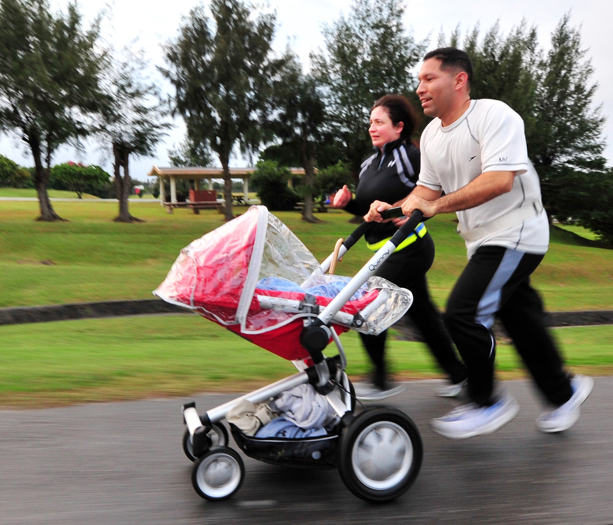 Capt. Jhames Illanez, his wife Mimet and his son Kaan, participated in the 5K hosted by the Top3 to raise money for the Haitian relief fund Feb. 5, 2010. The event raised $8K and will be collected with other fundraisers and presented to the American Red Cross here. Captain Illanez is from the 18th Aircraft Maintenance Squadron.
(U.S. Air Force photo/Tech. Sgt. Rey Ramon)  