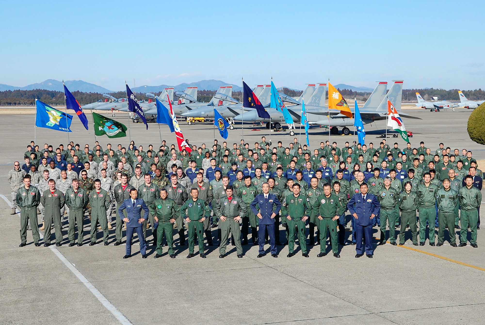 Airmen from Kadena and the Japan Air Self Defense Force stand side-by-side for a photo before the end of the aviation training relocation Feb. 5 at Hyakuri Air Base. (U.S. Air Force photo / 1st Lt. Bryan Bouchard)