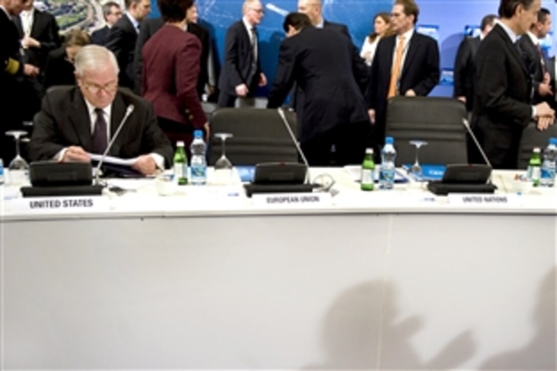 U.S. Defense Secretary Robert M. Gates reviews his paperwork before the start of the NATO Defense MInisterial in Istanbul, Feb. 5, 2010.  