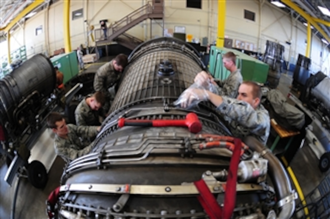 U.S. Air Force aerospace propulsion airmen with the 28th Maintenance Squadron work on a B-1B Lancer bomber engine at Ellsworth Air Force Base, S.D., on Feb. 3, 2010.  