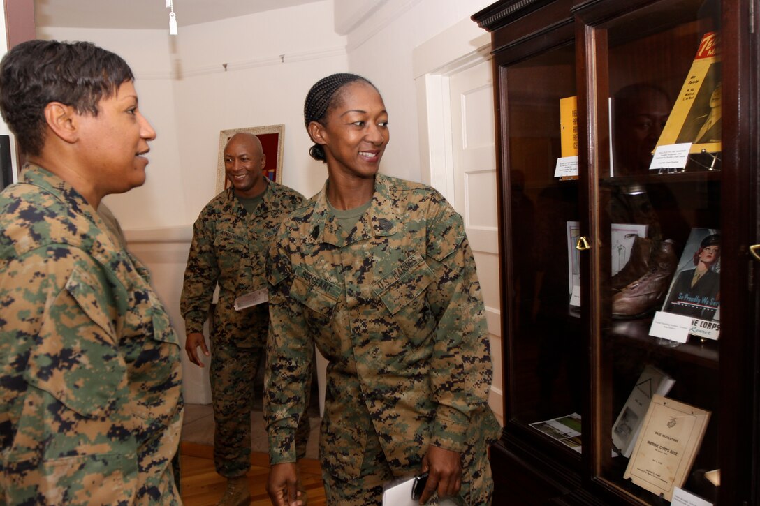 Sgt. Maj. Ramona D. Cook (left), sergeant major of Marine Corps Base Camp Pendleton, and Sgt. Maj. Shelley D. Sergeant, sergeant major of Marine Corps Air Station, Camp Pendleton observes artifacts during a special women Marines exhibit at base’s Santa Margarita Ranch House, Feb. 5.
