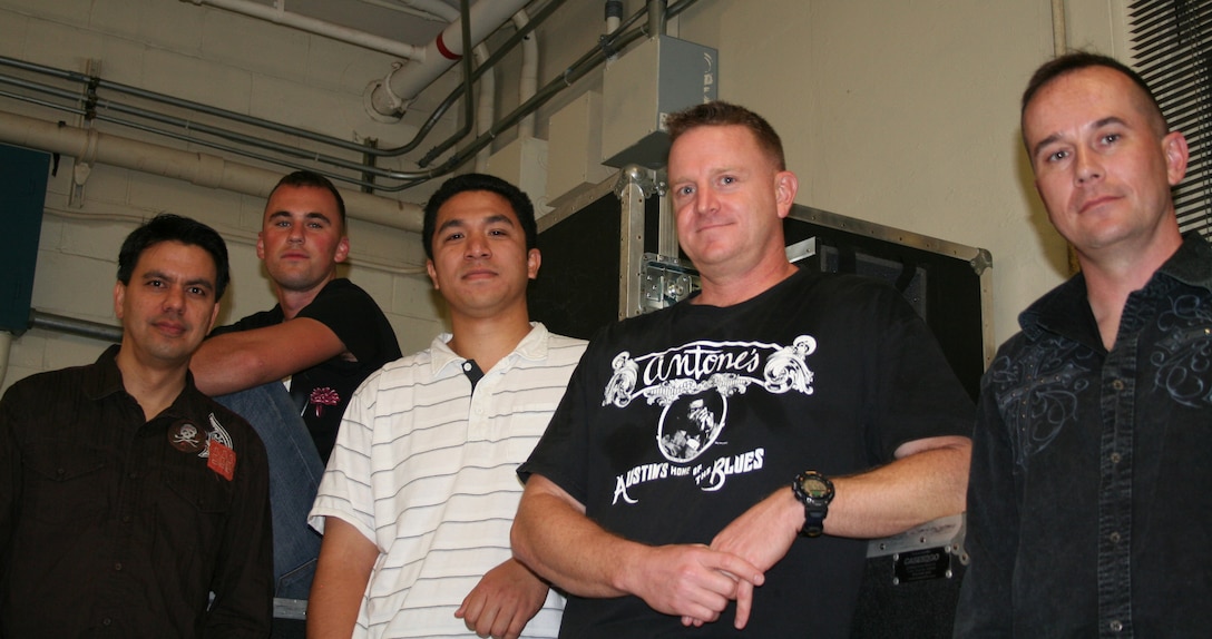 (From left to right)Jason Nobriga, electric guitar player, Sgt. Matt Cole, drummer, Ikaika Tecson, keyboard player and Staff Sgt. Chazz Harbison, bass player, all members of The Mike Corrado Band. They will be opening for Bon Jovi Feb. 12 after beating more than 50 competitors to become one of two bands performing before a sold out audience.