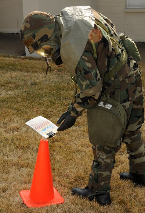 Staff Sgt. Dustin Barnes, 151st Maintenance Group, inspects M-8 chemical detection paper for contaminants during an Ability to Survive and Operate exercise on February 6 at the Utah Air National Guard Base.  The 151st Maintenance and Operations Groups are training for an upcoming Operational Readiness Exercise.  U.S. Air Force Photo by: Staff Sgt. Emily Monson (RELEASED)