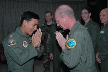 Master Sgt. Tom T. Freeman (right), loadmaster with the Air Force Reserve’s 302nd Airlift Wing, performs a wai, the traditional Thai greeting, after receiving the Thailand Modular Airborne Firefighting System patch from Wing Commander Prondech Kongpan, 601st squadron commander, Royal Thai Air Force at Phitsanulok RTAFB, Thailand upon the completion of MAFFS training.  Seven members of the 302 AW, based at Peterson AFB, Colo., traveled to Thailand and provided expert training to more than 50 RTAF members on safe and effective C-130 MAFFS operations.  This event marks the first time the Air Force Reserve has sent delegates to train a foreign Air Force on use of the MAFFS equipment. (U.S. Air Force photo)