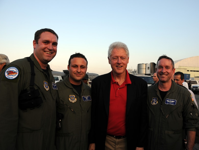 While on a Haiti relief mission picking up critically injured Haitians, aircrew from the 107th AW had the honor of meeting former President Bill Clinton. (From left to right) Staff Sgt. Brian Waite, 107th C-130 flight engineer, 1st Lt. Joe Neglia, 107th C-130 pilot,  President Bill Clinton and Maj. Greg Miller, 107th C-130 pilot. (U.S. Air Force photo/Staff Sgt. Peter Dean)