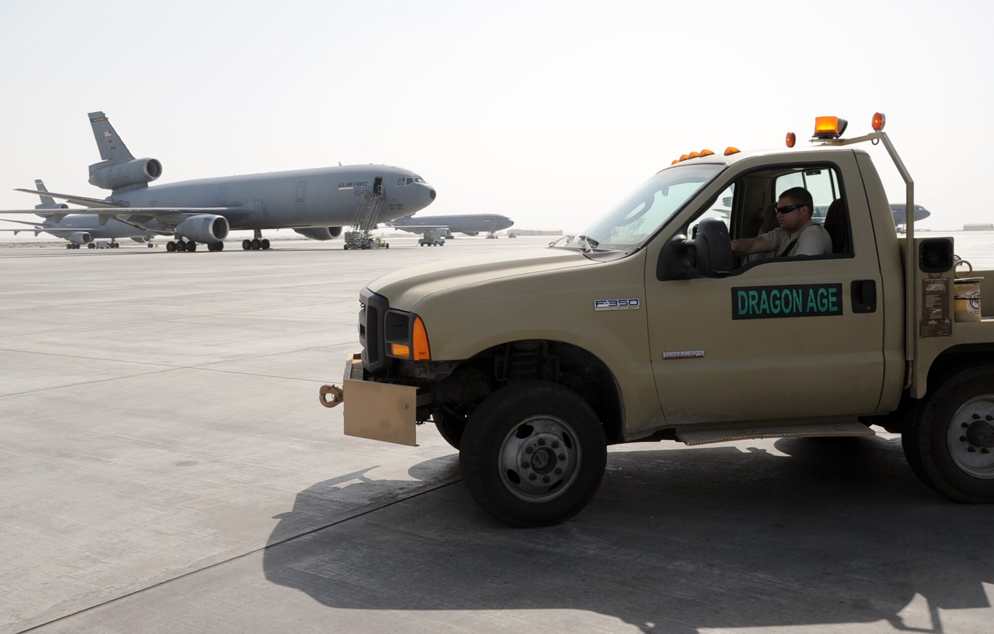 An Airman assigned to the 380th Expeditionary Aircraft Maintenance Squadron drives a maintenance truck on the flightline of a non-disclosed base in Southwest Asia on Feb. 1, 2010. Maintenance Airmen run shifts 24 hours a day supporting flying operations for the 380th Air Expeditionary Wing.  (U.S. Air Force Photo/Master Sgt. Scott T. Sturkol/Released)