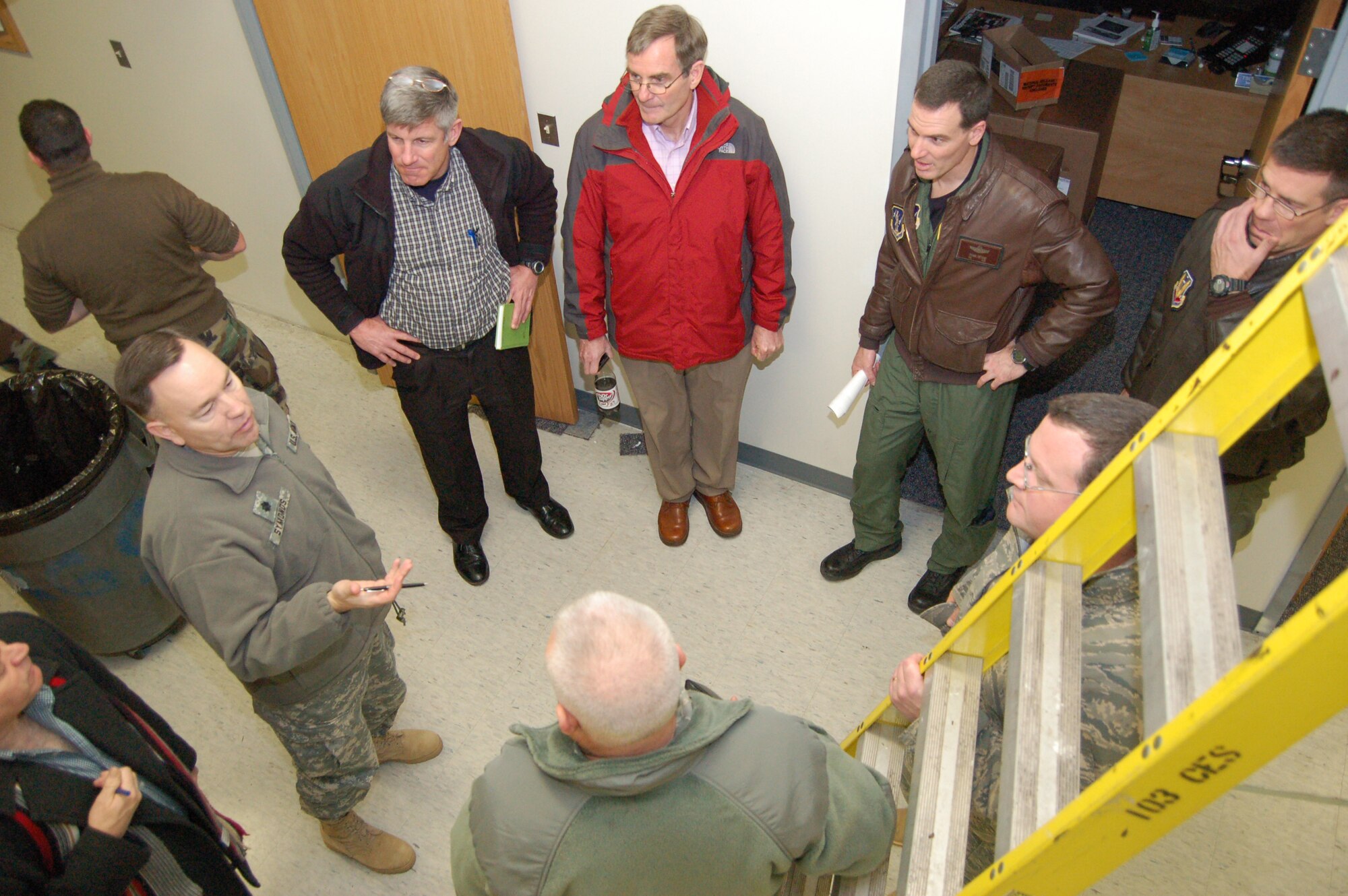Dave McKenzie and James Luebbe from the AOC Weapons System Integrator team review infrastructure requirements with Conn. Air National Guard leadership during the building site visit on Thursday, Feb. 4, 2010.  The walkthrough was part of a four-day site survey to determine the Conn. Air National Guard’s level of readiness to accept and support the installation of a 2.5 million dollar equipment suite that will enable the 103rd Air and Space Operations Group to achieve its initial operational capability. (U.S. Air Force photo by Tech. Sgt. Joshua A. Mead)