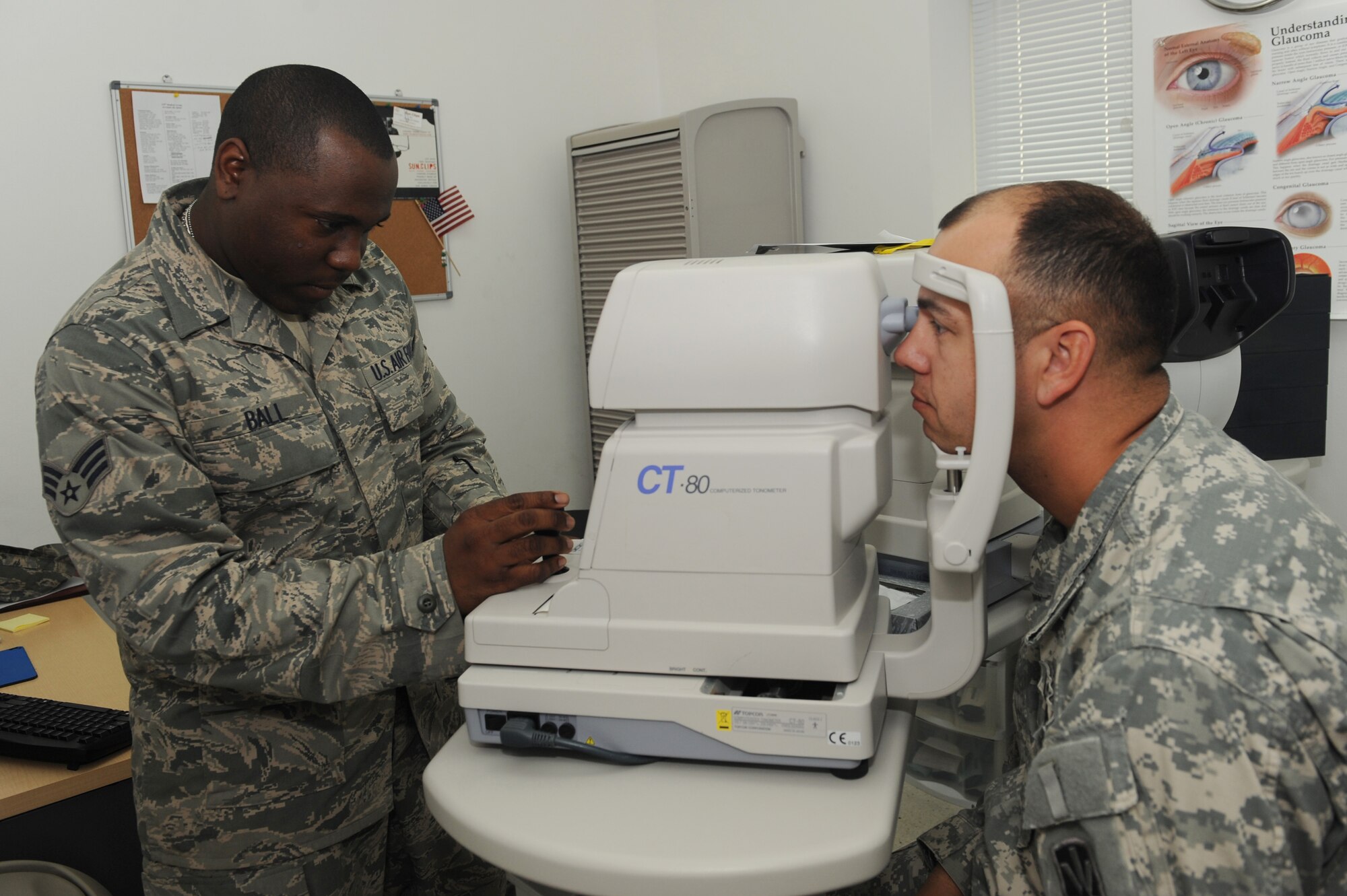 Senior Airman Princeton Ball, 379th Expeditionary Medical Group optometry technician, conducts an eye exam on Army Staff Sgt. James Huntington, Bravo Battery 143 Patriot missle operator, to determine if glasses will be needed at a non-disclosed Southwest Asia location, Feb. 04, 2010. (U.S. Air Force photo by Tech. Sgt. Michelle Larche)[RELEASED]