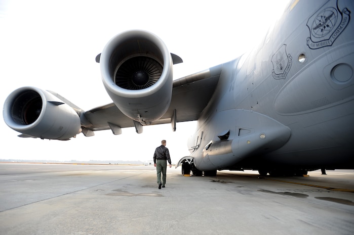 U.S. Air Force Capt. Brad Bowyer conducts his pre-flight inspection of a C-17 Globemaster III on the flightline here Feb. 4, 2010. The mission was flown as part of an evaluation to keep aircrew skills sharp and ready to perform duties anywhere, anytime. Captain Bowyer is a pilot with the 17th Airlift Squadron. (U.S. Air Force photo by Tech. Sgt. William Greer)