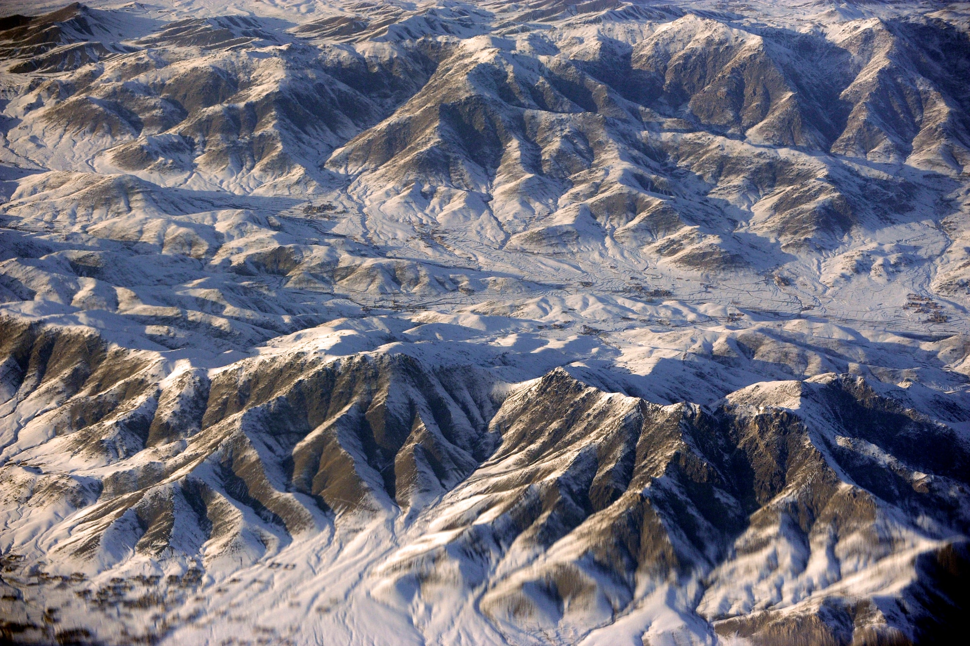 An aerial view from a C-17 Globemaster III window during a combat-airdrop mission bound for Afghanistan, Feb. 1, 2010. (U.S. Air Force photo/Staff Sgt. Manuel J. Martinez)
