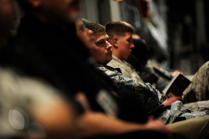 Passengers wait for take-off aboard a C-17 Globemaster III, Feb. 1, 2010, at an undisclosed location in Southwest Asia. The aircrew and aircraft are assigned to the 816th Expeditionary Airlift Squadron. A C-17 can seat 102 passengers with standard centerline seats or 134 troops with palletized seats. (U.S. Air Force photo/Staff Sgt. Manuel J. Martinez/released)