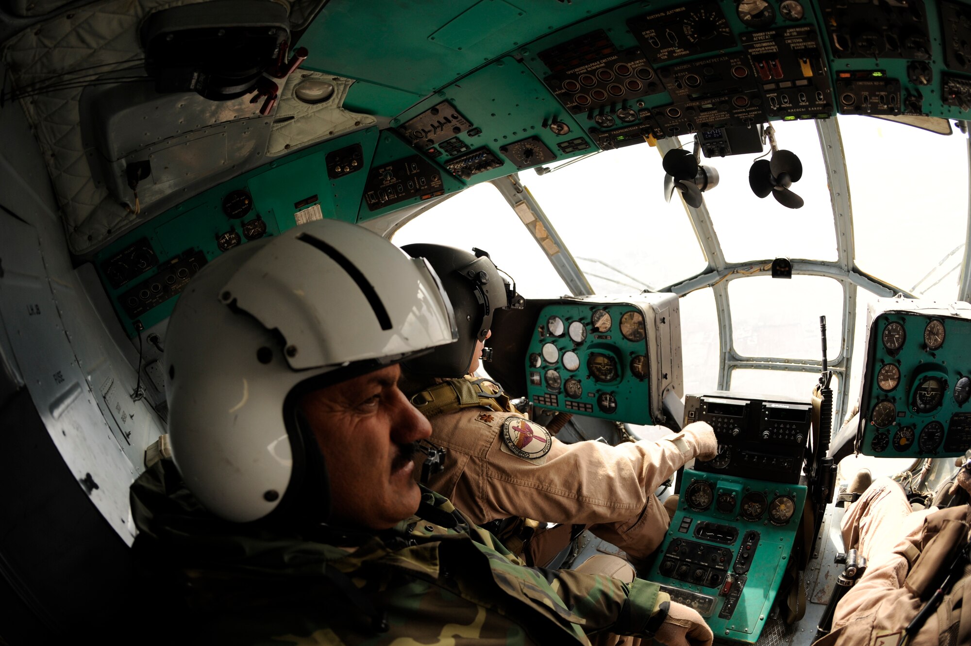 BAGRAM AIRFIELD, Afghanistan--A joint U.S. Air Force and Afghan National Army crew from the 438th Air Expeditionary Advisory Group/Combined Air Power Task Force, pilots a Mi-17 used for rotary wing medical evacuation missions, Feb. 3, 2010. This rotary wing medevac is the first of its kind in Afghanistan, where a combined Afghan and U.S. crew takes Afghans from coalition medical facilities and returns them to Afghan facilities. (U.S. Air Force photo by/ Tech. Sgt. Jeromy K. Cross/released)
