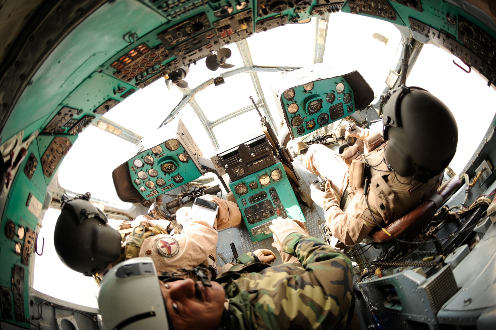 BAGRAM AIRFIELD, Afghanistan--A joint U.S. Air Force and Afghan National Army crew from the 438th Air Expeditionary Advisory Group/Combined Air Power Task Force, pilots a Mi-17 used for rotary wing medical evacuation missions, Feb. 3, 2010. This rotary wing medevac is the first of its kind in Afghanistan, where a combined Afghan and U.S. crew takes Afghans from coalition medical facilities and returns them to Afghan facilities. (U.S. Air Force photo by/ Tech. Sgt. Jeromy K. Cross/released)
