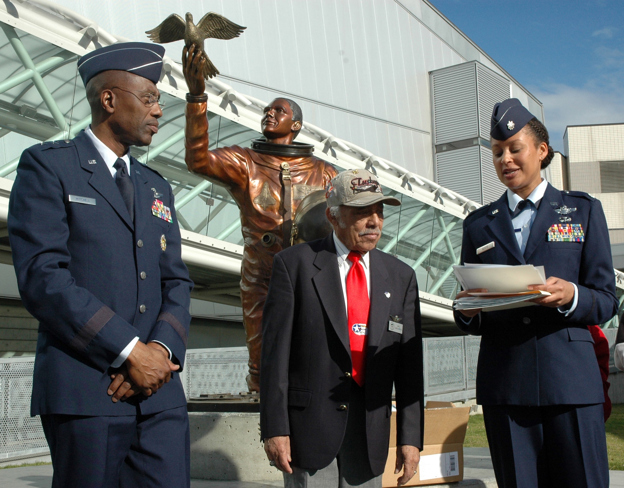 SEATTLE, Wash.- Maj. Gen. "Mitch" Mitchell, Deputy Inspector General of the Air Force (left), Tuskegee Airman Lt. Col. Bill Holloman (ret.), and Lt. Col. Kimberly Scott, 728th Airlift Squadron pilot, Joint Base Lewis-McChord, prepare to present certificates to students as part of the Michael Anderson Memorial Scholarship event at Seattle's Museum of Flight on Feb. 6. The scholarship, named in honor of the fallen Air Force pilot and astronaut, gives students from all over Washington state the opportunity to learn about the aerospace industry. (U.S. Air Force photo/Staff Sgt. Elizabeth Moody)