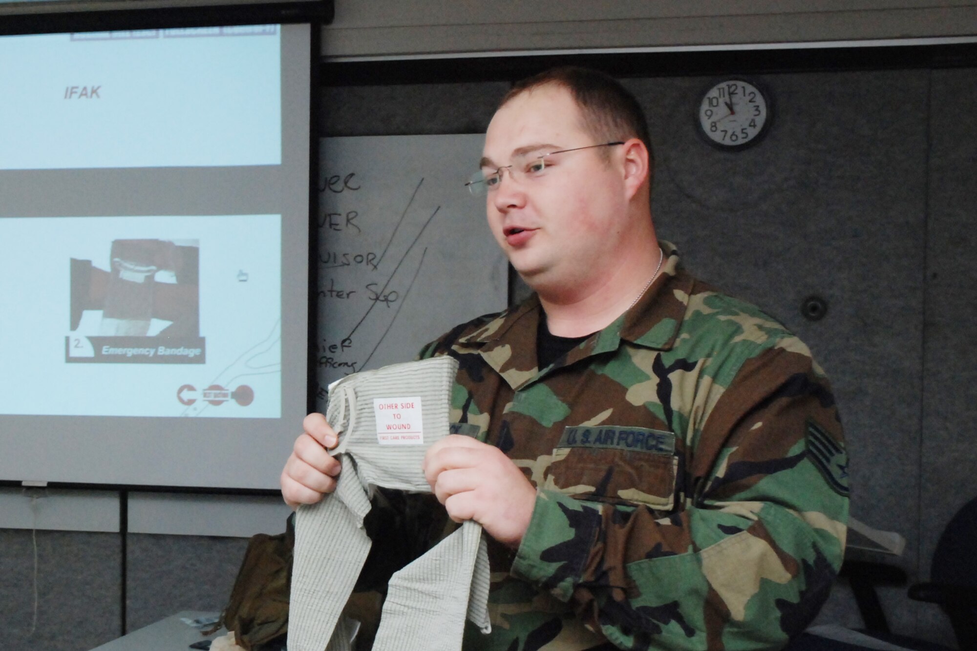 Staff Sgt. Rocky Hancock, 80th Aerial Port Squadron Self-Aid Buddy Care instructor, gives instruction on the application and use of  an elastic bandage during the hands- on training portion of the Air Force required first aid training.  (U.S. Air Force photo/Master Sgt. Stan Coleman)