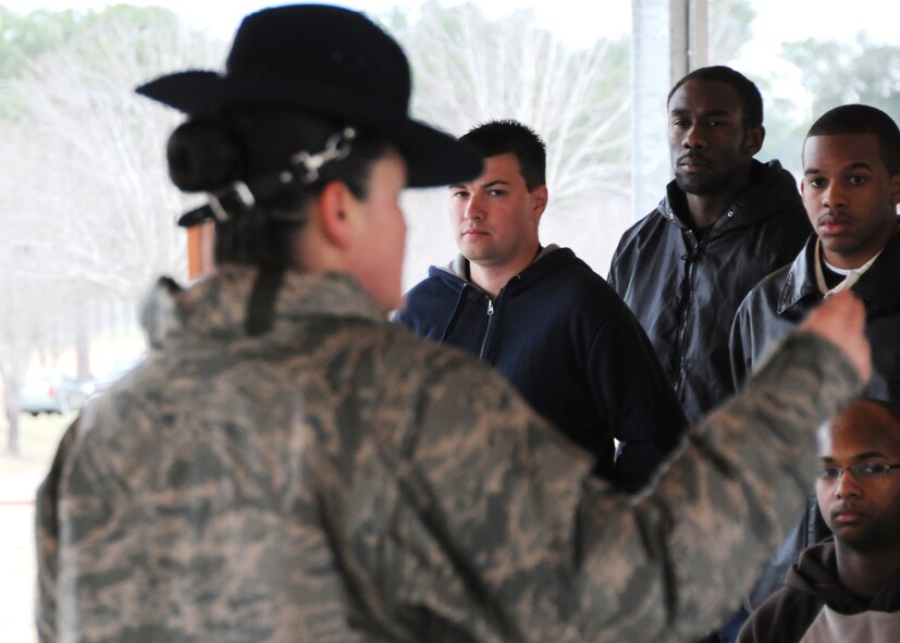 Christof Bader (middle) and other new Reserve recruits listen intently to instruction by Master. Sgt. Tiffany Lopez, 96th Force Support Squadron, Feb. 6 at Duke Field.  Sergeant Lopez and her husband, Tech. Sgt. Raul Lopez, 96th Logistics Readiness Squadron, both former active-duty military training instructors at Lackland AFB, Texas, volunteered their time to help new reserve recruits prepare for basic training during the drill weekend here.  The husband and wife team spent four years instructing new trainees at Lackland graduating 25 flights from Basic Military Training.  (U.S. Air Force photo/Tech. Sgt. Samuel King Jr.) 