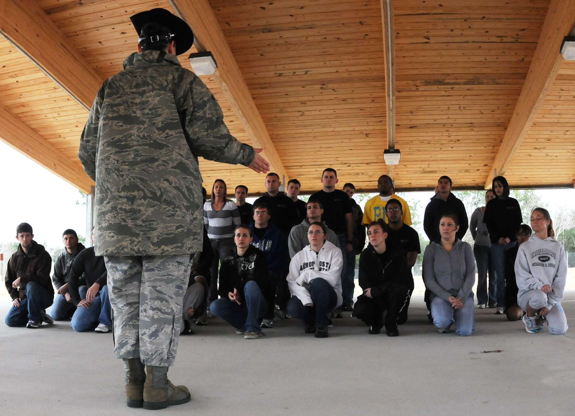 Master. Sgt. Tiffany Lopez, 96th Force Support Squadron, instructs a formation of new Air Force Reserve recruits on facing movements Feb. 6 at Duke Field.  Sergeant Lopez and her husband, Tech. Sgt. Raul Lopez, 96th Logistics Readiness Squadron, both former active-duty military training instructors at Lackland AFB, Texas, volunteered their time to help new reserve recruits prepare for basic training during the drill weekend here.  The husband and wife team spent four years instructing new trainees at Lackland graduating 25 flights from Basic Military Training.  (U.S. Air Force photo/Tech. Sgt. Samuel King Jr.) 