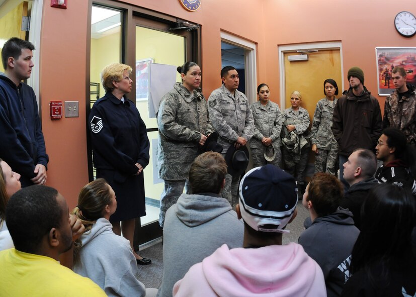 Master Sgt. Tiffany Lopez and husband Tech. Sgt. Raul Lopez, 96th Air Base Wing, take questions from new reserve enlistees about what it will be like at basic training.  The sergeants,  both former active-duty military training instructors at Lackland AFB, Texas, volunteered their time to help new the recruits prepare for basic training during the drill weekend here.  The instructors showed them how to line up, perform facing movements and deliver a reporting statement.  The husband and wife team spent four years instructing new trainees at Lackland graduated 25 flights from Basic Military Training.  (U.S. Air Force photo/Tech. Sgt. Samuel King Jr.) 
